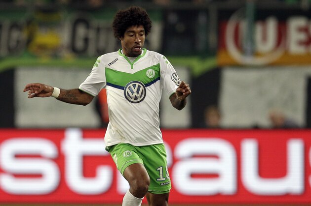Wolfsburg’s Dante plays the ball during the German soccer cup 2nd round match between VfL Wolfsburg and FC Bayern Munich in Wolfsburg, Germany, Tuesday, Oct. 27, 2015. (AP Photo/Michael Sohn)