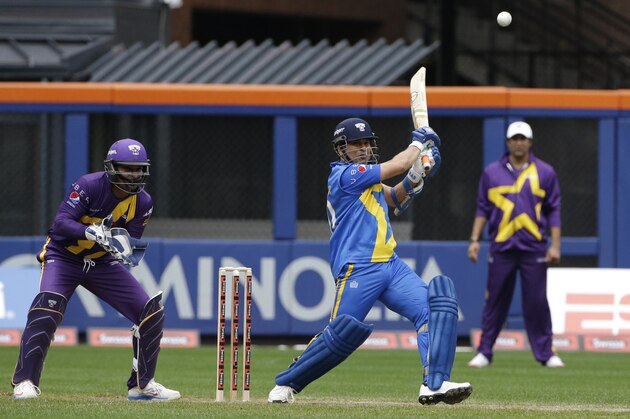 Sachin Tendulkar swings the bat during the Blasters inning of the first game of the Cricket All-Stars series games, Saturday, Nov. 7, 2015, at Citi Field in New York. The three-game series will be played in Major League Baseball stadiums in New York, Houston and Los Angeles.  (AP Photo/Mary Altaffer)