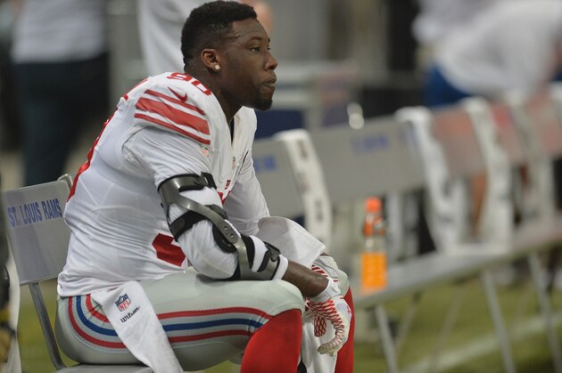ST. LOUIS, MO - DECEMBER 21: Jason Pierre-Paul #90 of the New York Giants watches from the sidelines during a game against the St. Louis Rams at the Edward Jones Dome on December 21, 2014 in St. Louis, Missouri. (Photo by Michael Thomas/Getty Images)