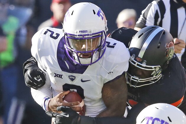 TCU quarterback Trevone Boykin (2) is sacked by Oklahoma State defensive end Jarrell Owens in the second quarter of an NCAA college football game in Stillwater, Okla., Saturday, Nov. 7, 2015. (AP Photo/Sue Ogrocki)