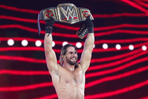 WWE Superstar Seth Rollins celebrates becoming the new WWE World Heavyweight Champion at WrestleMania 31 at Levi's Stadium on Sunday, March 29, 2015 in Santa Clara, CA. WrestleMania broke the Levi’s Stadium attendance record at 76,976 fans from all 50 states and 40 countries. (Don Feria/AP Images for WWE)