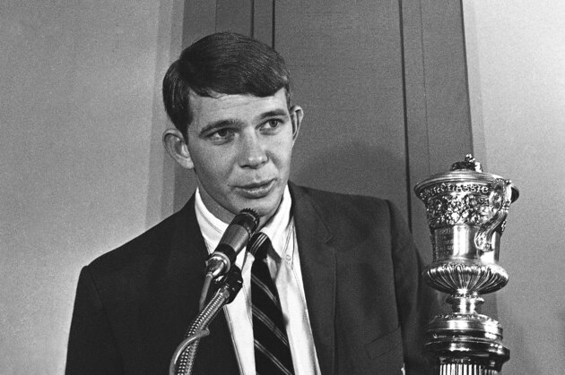 Quarterback Kenny Stabler, right, of the University of Alabama, is presented the Sugar Bowl “Most Valuable” player trophy in New Orleans, Louisiana  Monday, Jan. 3, 1967 for his performance in Alabama’s 34-7 win over the University of Nebraska. Dr. Wolfe is Vice President of the Sugar Bowl executive committee. (AP Photo/Charles Kelly)