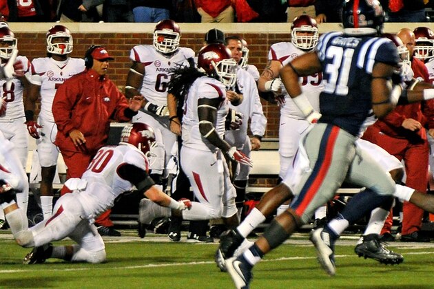 Arkansas running back Alex Collins (3) runs the ball after a last-minute lateral during overtime of an NCAA college football game against Mississippi in Oxford, Miss., Saturday, Nov. 7, 2015. Arkansas won 53-52. (AP Photo/Thomas Graning)