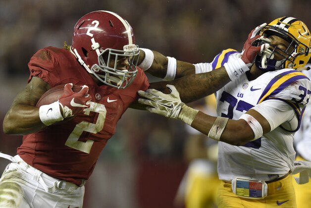 Nov 7, 2015; Tuscaloosa, AL, USA; Alabama Crimson Tide running back Derrick Henry (2) stiff-arms LSU Tigers safety Jamal Adams (33) during the second quarter at Bryant-Denny Stadium. Mandatory Credit: John David Mercer-USA TODAY Sports