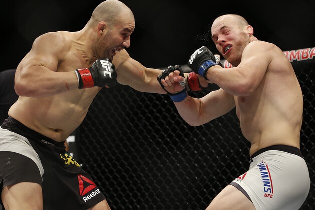 Glover Teixeira, of Brazil, left, fights Patrick Cummins, of the United States, during their UFC light heavyweight mixed martial arts bout in Sao Paulo, Brazil, Sunday, Nov. 8, 2015. (AP Photo/Andre Penner) Glover Teixeira, of Brazil, left, fights Patrick Cummins, of the United States, during their UFC light heavyweight mixed martial arts bout in Sao Paulo, Brazil, Sunday, Nov. 8, 2015. (AP Photo/Andre Penner)