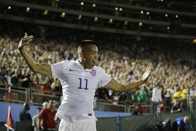 United States’ Bobby Wood celebrates scoring his side's 2nd goal against Mexico during the CONCACAF Confederations Cup playoff soccer match at the Rose Bowl Stadium, in Pasadena , Calif. Saturday, Oct. 10, 2015, (AP Photo/Jae C. Hong)