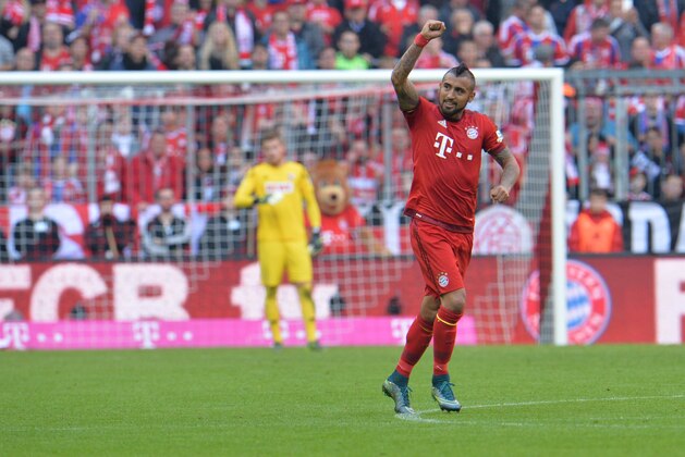 Bayern's Arturo Vidal celebrates after scoring during the German Bundesliga soccer match between FC Bayern Munich and FC Cologne in the Allianz Arena in Munich, Germany, on Saturday, Oct. 24, 2015. (AP Photo/Kerstin Joensson)