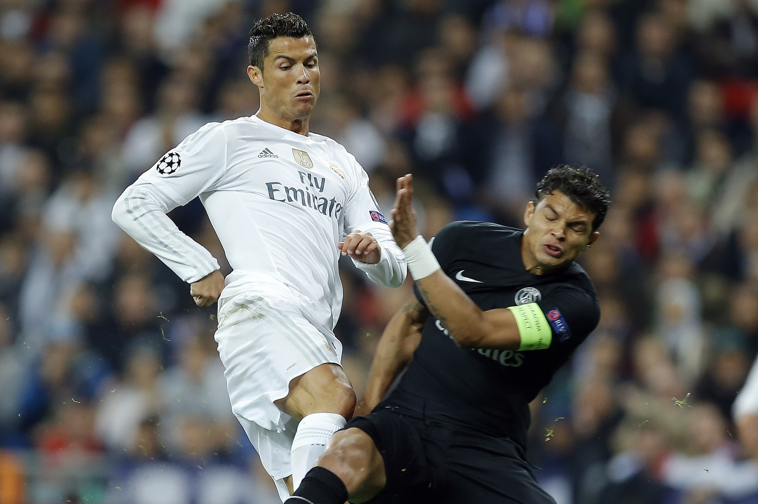 Real Madrid's Cristiano Ronaldo, left, and PSG's Thiago Silva fight for the ball during the Champions League group A soccer match between Real Madrid and PSG at the Santiago Bernabeu stadium in Madrid, Tuesday, Nov. 3, 2015. (AP Photo/Francisco Seco) Real Madrid's Cristiano Ronaldo, left, and PSG's Thiago Silva fight for the ball during the Champions League group A soccer match between Real Madrid and PSG at the Santiago Bernabeu stadium in Madrid, Tuesday, Nov. 3, 2015. (AP Photo/Francisco Seco)