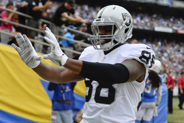 Oakland Raiders tight end Clive Walford reacts after scoring a touchdown during the first half of an NFL football game against the San Diego Chargers Sunday, Oct. 25, 2015, in San Diego. (AP Photo/Denis Poroy)