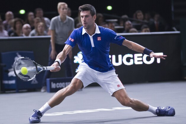 Britain's Andy Murray returns the ball to Serbia's Novak Djokovic during their final match of the BNP Masters tennis tournament at the Paris Bercy Arena, in Paris, France, Sunday, Nov. 8, 2015. (AP Photo/Michel Euler)