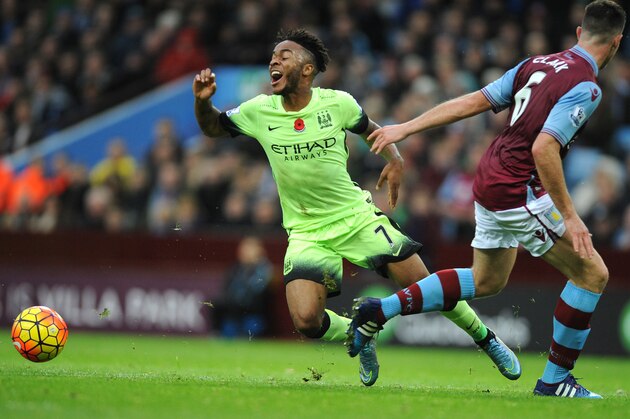 Manchester City’s Raheem Sterling, left, is tackled by Aston Villa’s Ciaran Clark during the English Premier League soccer match between Aston Villa and Manchester City at the Villa Park, Birmingham, England, Sunday, Nov. 8, 2015. (AP Photo/Rui Vieira)