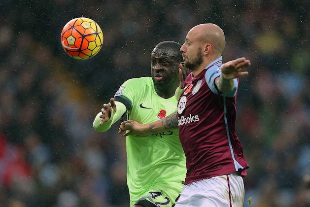 BIRMINGHAM, ENGLAND - NOVEMBER 08:  Yaya Toure of Manchester City and Alan Hutton of Aston Villa during the Barclays Premier League match between Aston Villa and Manchester City at Villa Park on November 8, 2015 in Birmingham, England.  (Phoyo by James Baylis - AMA/Getty Images)