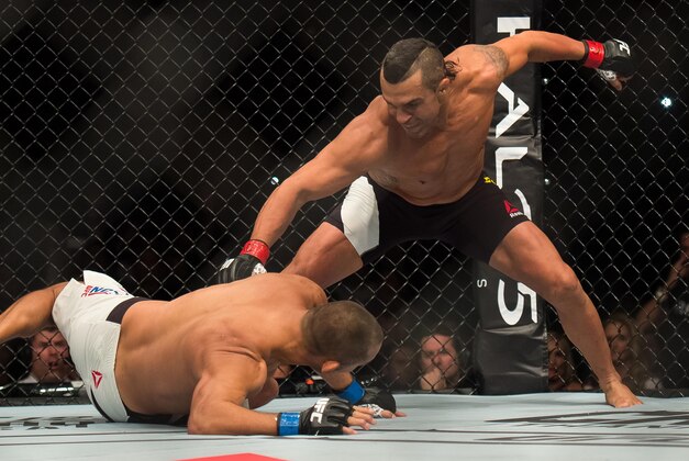 Nov 7, 2015; Sao Paulo, Brazil;  Vitor Belfort (red gloves) competes against Dan Henderson (blue gloves) during UFC Fight Night at Ibirapuera Gymnasium. Mandatory Credit: Jason Silva-USA TODAY Sports