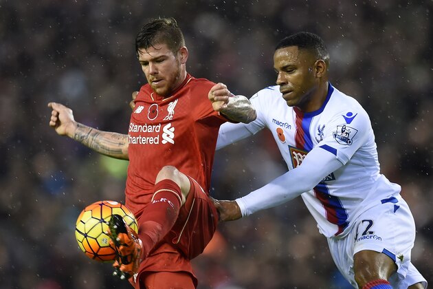 Liverpool's Spanish defender Alberto Moreno (L) vies against Crystal Palace's English midfielder Jason Puncheon during the English Premier League football match between Liverpool and Crystal Palace at the Anfield stadium in Liverpool, north-west England on November 8, 2015. AFP PHOTO / PAUL ELLIS
RESTRICTED TO EDITORIAL USE. No use with unauthorized audio, video, data, fixture lists, club/league logos or 'live' services. Online in-match use limited to 75 images, no video emulation. No use in betting, games or single club/league/player publications. (Photo credit should read PAUL ELLIS/AFP/Getty Images) Liverpool's Spanish defender Alberto Moreno (L) vies against Crystal Palace's English midfielder Jason Puncheon during the English Premier League football match between Liverpool and Crystal Palace at the Anfield stadium in Liverpool, north-west England on November 8, 2015. AFP PHOTO / PAUL ELLIS
RESTRICTED TO EDITORIAL USE. No use with unauthorized audio, video, data, fixture lists, club/league logos or 'live' services. Online in-match use limited to 75 images, no video emulation. No use in betting, games or single club/league/player publications. (Photo credit should read PAUL ELLIS/AFP/Getty Images)