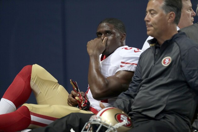 San Francisco 49ers running back Reggie Bush is taken off on a cart during the first quarter of an NFL football game against the St. Louis Rams Sunday, Nov. 1, 2015, in St. Louis. (AP Photo/Tom Gannam)