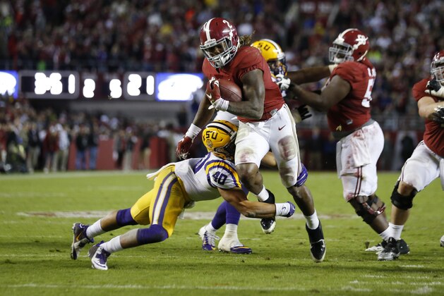 Alabama running back Derrick Henry (2) is hit by LSU linebacker Duke Riley (40) in the second half of an NCAA college football game Saturday, Nov. 7, 2015, in Tuscaloosa , Ala. (AP Photo/John Bazemore)