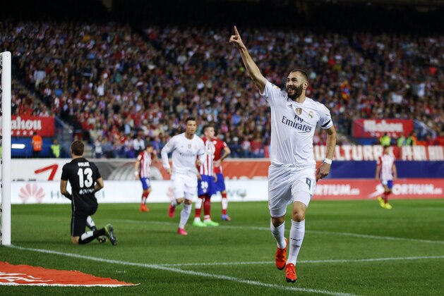 Real Madrid's Karim Benzema, center, celebrates after scoring a goal during a Spanish La Liga soccer match between Real Madrid and Atletico de Madrid at the at the Vicente Calderon stadium in Madrid, Spain, Sunday, Oct. 4, 2015. (AP Photo/Daniel Ochoa de Olza)