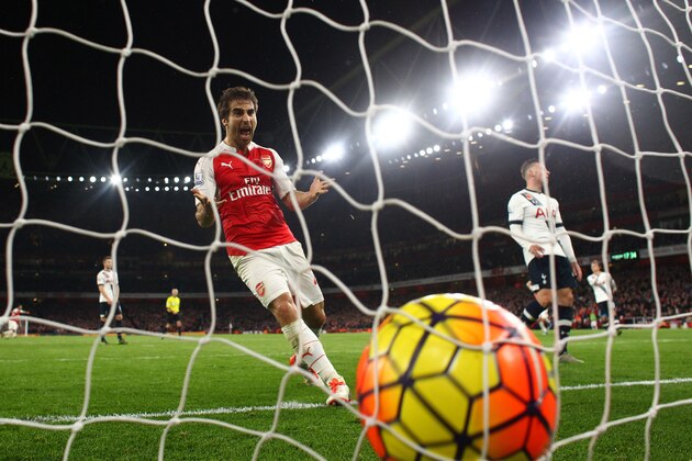 LONDON, ENGLAND - NOVEMBER 08:  Mathieu Flamini of Arsenal celebrates his team's second goal scored by Kieran Gibbs of Arsenal (not pictured) during the Barclays Premier League match between Arsenal and Tottenham Hotspur at the Emirates Stadium on November 8, 2015 in London, England.  (Photo by Julian Finney/Getty Images)