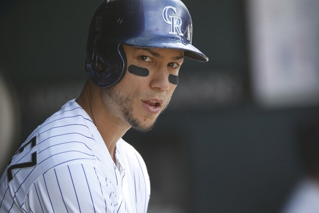 Colorado Rockies' Carlos Gonzalez waits to bat in the third inning of a baseball game Sunday, Sept. 27, 2015, in Denver. (AP Photo/David Zalubowski) Colorado Rockies' Carlos Gonzalez waits to bat in the third inning of a baseball game Sunday, Sept. 27, 2015, in Denver. (AP Photo/David Zalubowski)