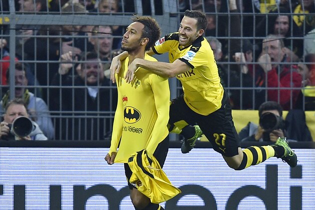 Dortmund's Pierre-Emerick Aubameyang shows a batman shirt after he scored during the German Bundesliga soccer match between Borussia Dortmund and FC Schalke 04 in Dortmund, Germany, Sunday, Nov. 8, 2015. (AP Photo/Martin Meissner)