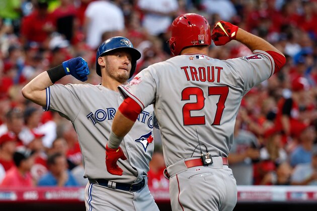 CINCINNATI, OH - JULY 14:  American League All-Star Mike Trout #27 of the Los Angeles Angels of Anaheim celebrates with teammate American League All-Star Josh Donaldson #20 of the Toronto Blue Jays after hitting a lead off home run in the first inning against National League All-Star Zack Greinke #21 of the Los Angeles Dodgers during the 86th MLB All-Star Game at the Great American Ball Park on July 14, 2015 in Cincinnati, Ohio.  (Photo by Rob Carr/Getty Images)