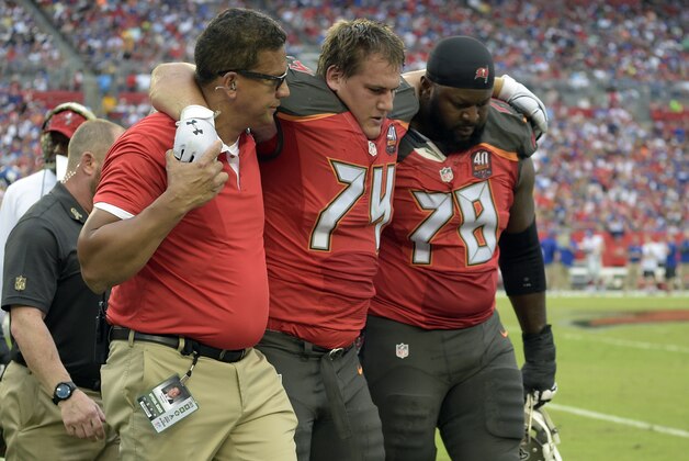 Tampa Bay Buccaneers offensive guard Ali Marpet (74) is helped off the field during the second quarter of an NFL football game against the New York Giants Sunday, Nov. 8, 2015, in Tampa, Fla. (AP Photo/Phelan M. Ebenhack)