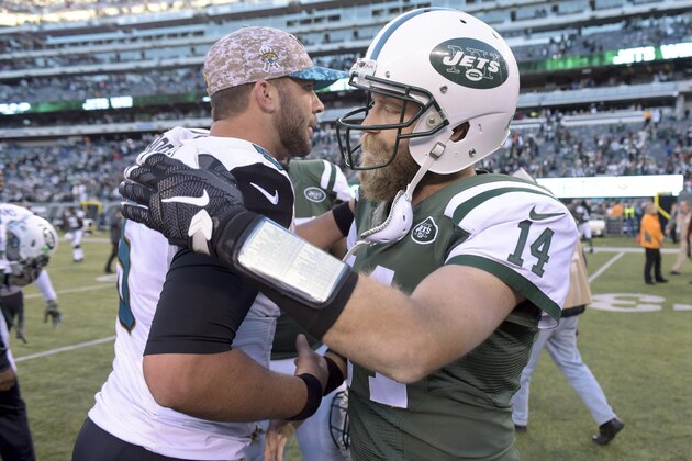 New York Jets quarterback Ryan Fitzpatrick (14) greets Jacksonville Jaguars quarterback Blake Bortles (5) after the Jets beat the Jaguars 28-23 in an NFL football game, Sunday, Nov. 8, 2015, in East Rutherford, N.J. (AP Photo/Bill Kostroun)