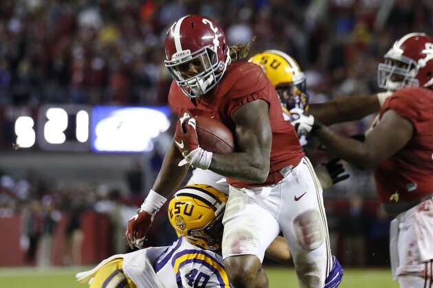 Alabama running back Derrick Henry (2) is hit by LSU linebacker Duke Riley (40) in the second half of an NCAA college football game Saturday, Nov. 7, 2015, in Tuscaloosa , Ala. (AP Photo/John Bazemore)