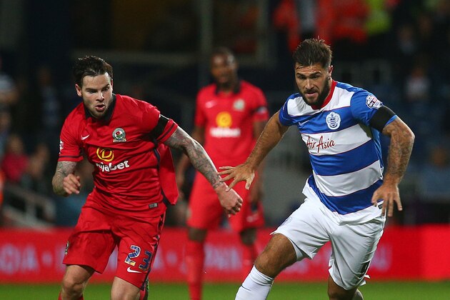 LONDON, ENGLAND - SEPTEMBER 16: QPR's Charlie Austin looks to break away from Danny Guthrie of Blackburn during the Sky Bet Championship match between Queens Park Rangers and Blackburn Rangers at Loftus Road on September 16, 2015 in London, England. (Photo by Charlie Crowhurst/Getty Images)