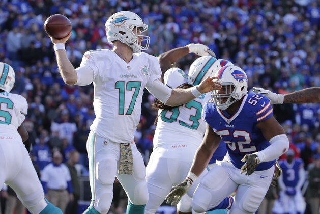 Buffalo Bills middle linebacker Preston Brown (52) closes in on Miami Dolphins' Ryan Tannehill (17) during the first half of an NFL football game Sunday, Nov. 8, 2015, in Orchard Park, N.Y. (AP Photo/Bill Wippert)