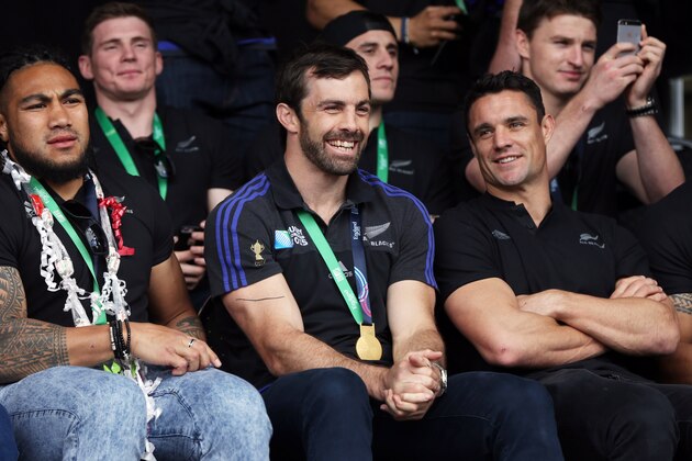 (L-R) All Blacks Ma'a Nonu, Conrad Smith and Dan Carter  smile at a parade and official welcome for the rugby team in Auckland on November 4, 2015, following the their Rugby World Cup win against Australia. The New Zealand All Blacks returned to Auckland after they won the Rugby World Cup beating Australia in the final in England. AFP PHOTO / Michael Bradley        (Photo credit should read MICHAEL BRADLEY/AFP/Getty Images)