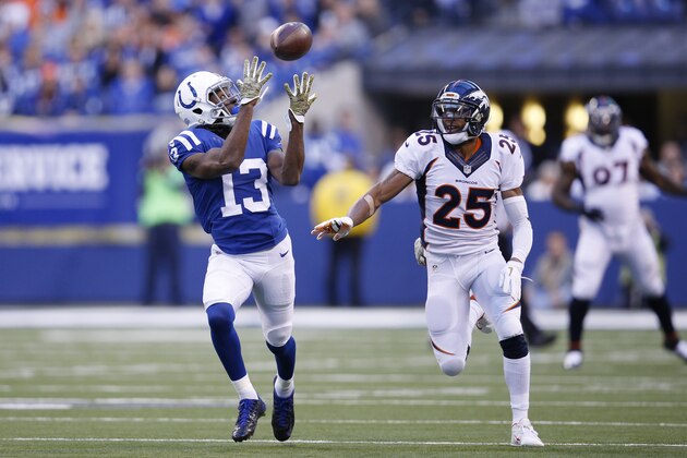 INDIANAPOLIS, IN - NOVEMBER 8 T.Y. Hilton #13 of the Indianapolis Colts makes a 28-yard reception behind Aqib Talib #25 of the Denver Broncos in the first quarter of the game at Lucas Oil Stadium on November 8, 2015 in Indianapolis, Indiana. (Photo by Joe Robbins/Getty Images)