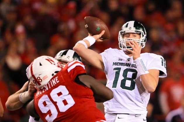 Michigan State quarterback Connor Cook (18) throws during the second half of an NCAA college football game against Nebraska in Lincoln, Neb., Saturday, Nov. 7, 2015. Nebraska won 39-38. (AP Photo/Nati Harnik)