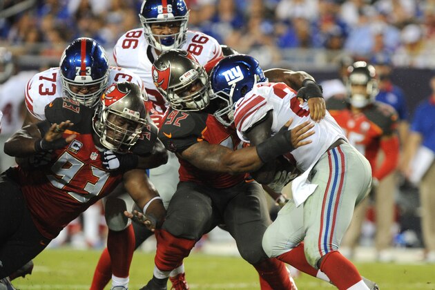 TAMPA, FL - NOVEMBER 8: Running back Rashad Jennings #23 of the New York Giants is tackled by defensive end William Gholston #92 of the Tampa Bay Buccaneers in the fourth quarter at Raymond James Stadium on November 8, 2015 in Tampa, Florida. (Photo by Cliff McBride/Getty Images)