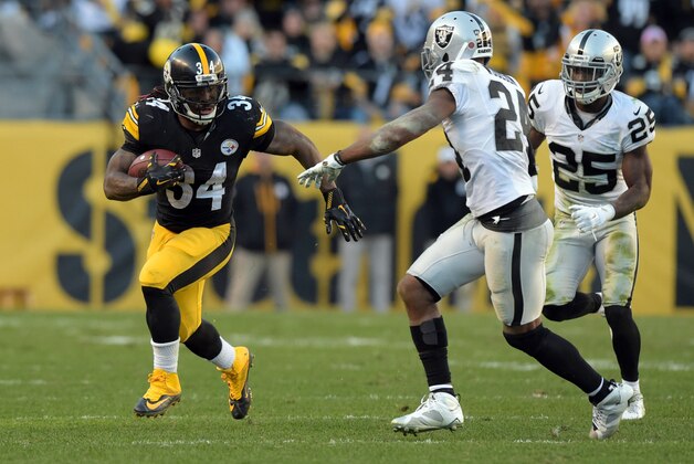 Nov 8, 2015; Pittsburgh, PA, USA; Pittsburgh Steelers running back Deangelo Williams (34) is pursued by Oakland Raiders safety Charles Woodson (24) and cornerback D.J. Hayden (25) in a NFL football game against the Oakland Raiders at Heinz Field. Mandatory Credit: Kirby Lee-USA TODAY Sports