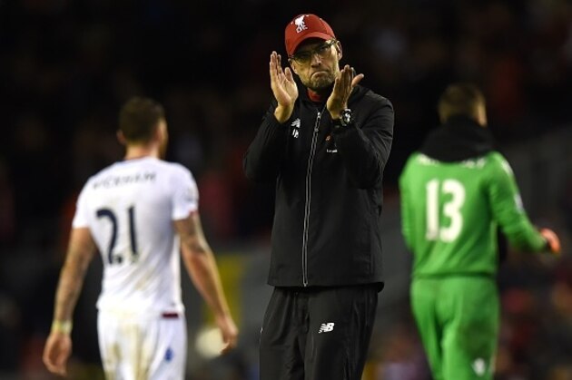 Liverpool's German manager Jurgen Klopp (C) applauds the fans after losing the English Premier League football match between Liverpool and Crystal Palace at the Anfield stadium in Liverpool, north-west England on November 8, 2015.     AFP PHOTO / PAUL ELLIS

RESTRICTED TO EDITORIAL USE. No use with unauthorized audio, video, data, fixture lists, club/league logos or 'live' services. Online in-match use limited to 75 images, no video emulation. No use in betting, games or single club/league/player publications.        (Photo credit should read PAUL ELLIS/AFP/Getty Images)
