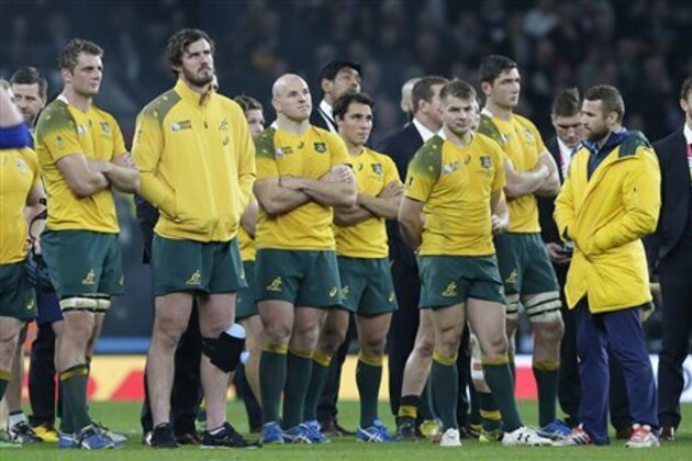 Australian players react after the Rugby World Cup final between New Zealand and Australia at Twickenham Stadium in London,  Saturday, Oct. 31, 2015. (AP Photo/Tim Ireland)