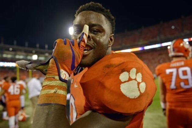 CORRECTS SCORE TO 23-13 NOT 23-17 - Clemson's Shaq Lawson celebrates in the closing minutes of their 23-13 win over Florida State in an NCAA college football game, Saturday, Nov. 7, 2015,  in Clemson,  S.C. (AP Photo/Richard Shiro)