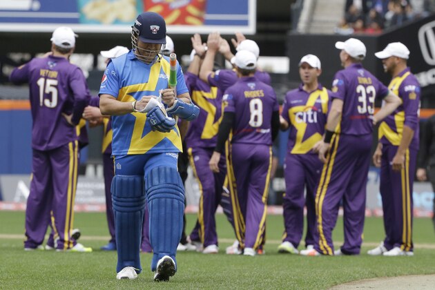 Warne's Warriors, celebrate as Sachin Tendulkar leaves the field after making an out during the first of the Cricket All-Stars series, Saturday, Nov. 7, 2015, at Citi Field in New York. The three-game series will be played in Major League Baseball stadiums in New York, Houston and Los Angeles. (AP Photo/Mary Altaffer)
