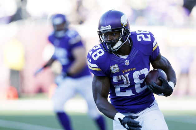 Minnesota Vikings running back Adrian Peterson (28) rushes during the second half of an NFL football game against the St. Louis Rams, Sunday, Nov. 8, 2015, in Minneapolis. (AP Photo/Jim Mone)