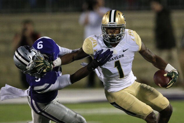 Baylor wide receiver Corey Coleman (1) gets away from Kansas State linebacker Elijah Lee (9) during the first half of an NCAA college football game in Manhattan, Kan., Thursday, Nov. 5, 2015. (AP Photo/Orlin Wagner)