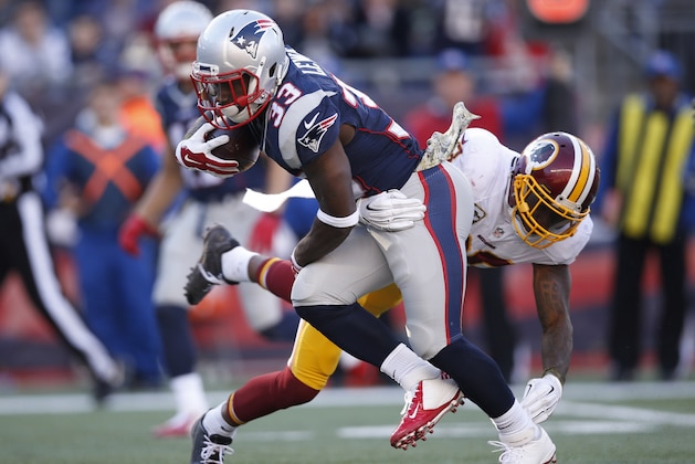 Nov 8, 2015; Foxborough, MA, USA; New England Patriots running back Dion Lewis (33) is tackled by Washington Redskins defensive back Tanard Jackson (36) during the second quarter at Gillette Stadium. Mandatory Credit: Greg M. Cooper-USA TODAY Sports