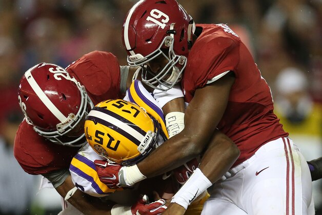 LSU quarterback Brandon Harris (6) is hit by Alabama linebacker Reggie Ragland (19) and Alabama defensive back Marlon Humphrey (26) in the first half of an NCAA college football game Saturday, Nov. 7, 2015, in Tuscaloosa , Ala. (AP Photo/John Bazemore) LSU quarterback Brandon Harris (6) is hit by Alabama linebacker Reggie Ragland (19) and Alabama defensive back Marlon Humphrey (26) in the first half of an NCAA college football game Saturday, Nov. 7, 2015, in Tuscaloosa , Ala. (AP Photo/John Bazemore)