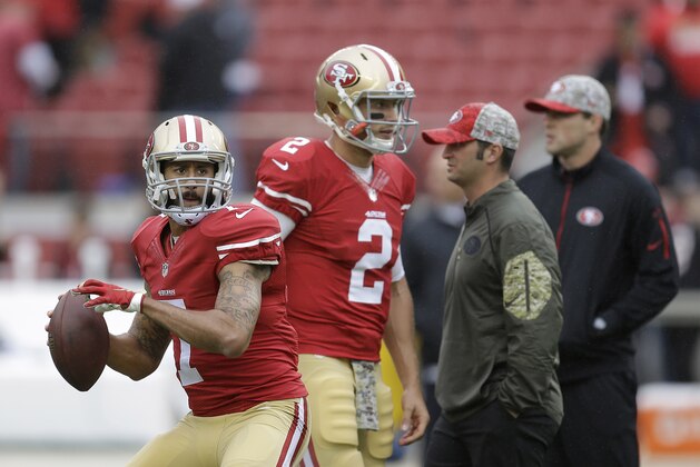 San Francisco 49ers quarterback Colin Kaepernick (7) warms up next to quarterback Blaine Gabbert (2) before an NFL football game against the Atlanta Falcons in Santa Clara, Calif., Sunday, Nov. 8, 2015. (AP Photo/Ben Margot)