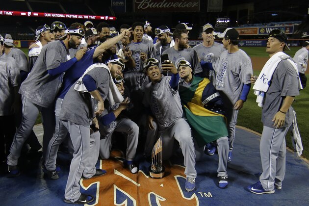Kansas City Royals pose with World Series trophy after Game 5 of the Major League Baseball World Series against the New York Mets Monday, Nov. 2, 2015, in New York. The Royals won 7-2 to win the series. (AP Photo/Matt Slocum)