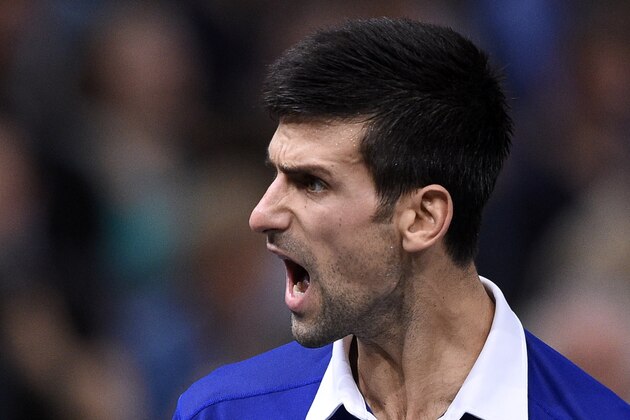 Serbia's Novak Djokovic reacts during the final tennis match against Britain's Andy Murray at the ATP World Tour Masters 1000 indoor tennis tournament in Paris on November 8, 2015.  AFP PHOTO / FRANCK FIFE        (Photo credit should read FRANCK FIFE/AFP/Getty Images)