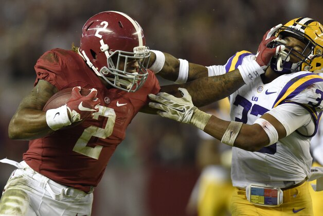 Nov 7, 2015; Tuscaloosa, AL, USA; Alabama Crimson Tide running back Derrick Henry (2) stiff-arms LSU Tigers safety Jamal Adams (33) during the second quarter at Bryant-Denny Stadium. Mandatory Credit: John David Mercer-USA TODAY Sports