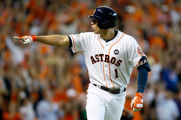 HOUSTON, TX - OCTOBER 12:  Carlos Correa #1 of the Houston Astros celebrates by pointing to his dugout after hitting a two-run home run in the bottom of the seventh inning, his second home run of the game, against the Kansas City Royals during game four of the American League Divison Series at Minute Maid Park on October 12, 2015 in Houston, Texas.  (Photo by Bob Levey/Getty Images)