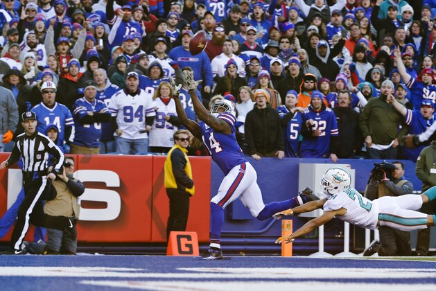 Buffalo Bills wide receiver Sammy Watkins (14) catches a pass for a touchdown in front of Miami Dolphins' Brent Grimes (21) during the second half of an NFL football game Sunday, Nov. 8, 2015, in Orchard Park, N.Y. (AP Photo/Bill Wippert)