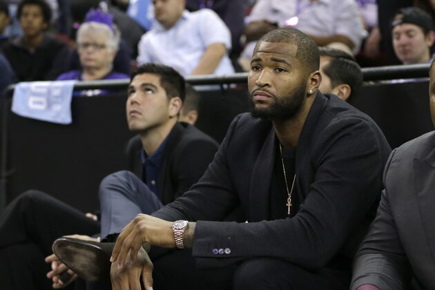 Sacramento Kings center DeMarcus Cousins watches the Kings' 116-110 loss to the Houston Rockets in an NBA basketball game in Sacramento, Calif., Friday, Nov. 6, 2015. Cousins missed the game due to an strained Achilles tendon. (AP Photo/Rich Pedroncelli)